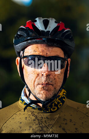 Mountain biker with muddy face after a ride Stock Photo