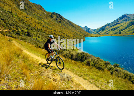 Mountain biker on the Moke Lake Trail near Queenstown, New Zealand Stock Photo
