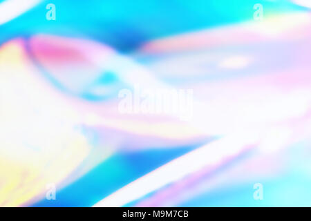 Colorful bright holographic background with light waves. Vibrant Holographic foil background. Stock Photo