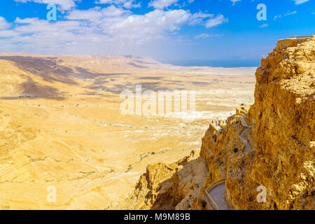 MASADA, ISRAEL - MARCH 16, 2018: Remains of the fortress of Masada, with visitors, and landscape, on the eastern edge of the Judaean Desert, Southern  Stock Photo