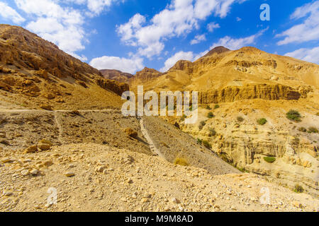 EIN GEDI, ISRAEL - MARCH 16, 2018: Landscape of desert cliffs, with visitors, in the Ein Gedi Nature Reserve, Judaean Desert, Southern Israel Stock Photo