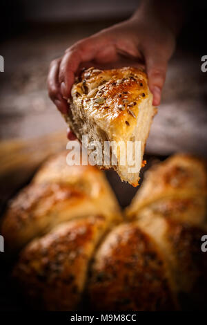 Close up of freshly baked wheat buns with mix of seeds Stock Photo