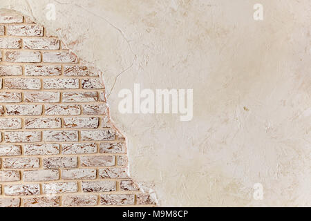Old Vintage Red Brick Wall With Crashed White Plaster Texture Background. White Retro Building Brickwork Wallpaper. Vintage brick wall with shabby whi Stock Photo