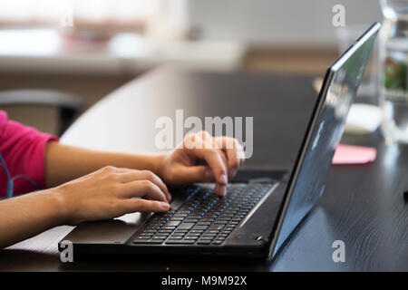 Print on laptop. Work at the computer. Work in the office at the computer. Hands on the keyboard Stock Photo