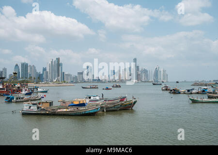 Boats near fish market and skyscraper skyline, coast of Panama City, Panama Stock Photo