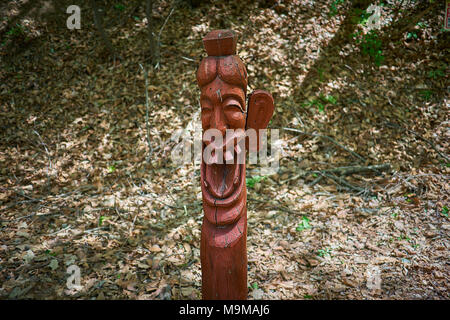 Korea's traditional female totem pole in Sanjeong Lake, Pocheon, with smile on the face and one ear made of wood. Stock Photo
