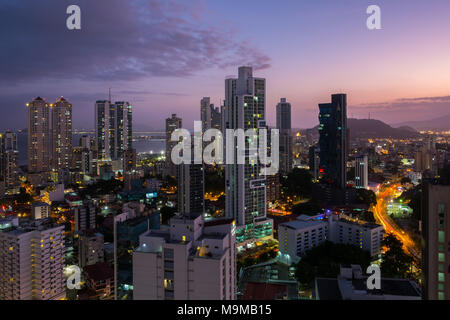 Panama City skyline at night - Modern skyscrapers with sunset sky - Stock Photo