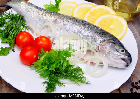 rainbow trout with lemon and fresh vegetables Stock Photo