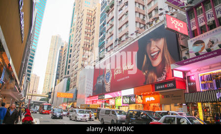 Hong Kong, China - January 1, 2016: Central streets of Hong Kong. Billboards. Shopping centers and fashion shops. High-rise architectural infrastructure. Hotels. Places of entertainment and recreation. Stock Photo