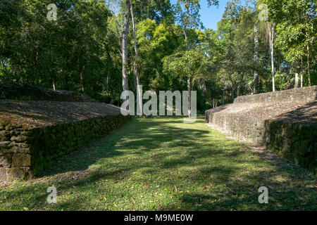 Ancient ball court ruins from the Mayan archeological site in Uaxactun, Guatemala  where ceremonial rituals were performed. Stock Photo