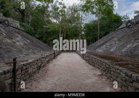 Ancient ball court ruins from the Mayan archeological site in Coba, Mexico  where ceremonial rituals were performed. Stock Photo
