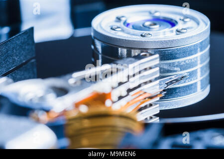 Hard disk drive inside close-up, spindle, actuator arm, read write head, platter Stock Photo