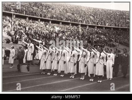 Vintage 1936 Olympics The bronze medal Hungarian women's gymnastics team giving the required Adolf Hitler salute Seig Heil Stock Photo