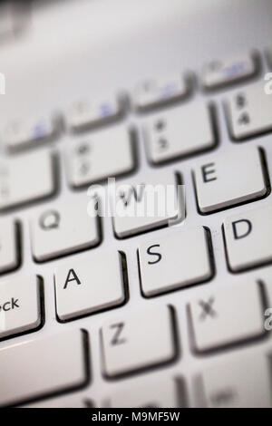 Close up keyboard of a modern laptop, selective focus, close up. Stock Photo