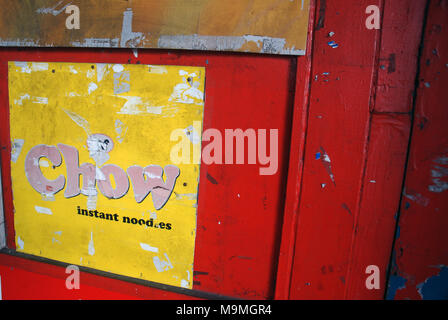 Chow Instant Noodle advert on red door, Suva, Fiji. Stock Photo