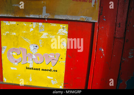 Chow Instant Noodle advert on red door, Suva, Fiji. Stock Photo