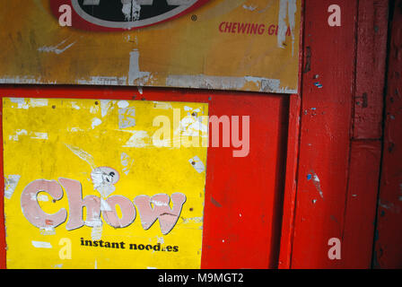 Chow Instant Noodle advert on red door, Suva, Fiji. Stock Photo