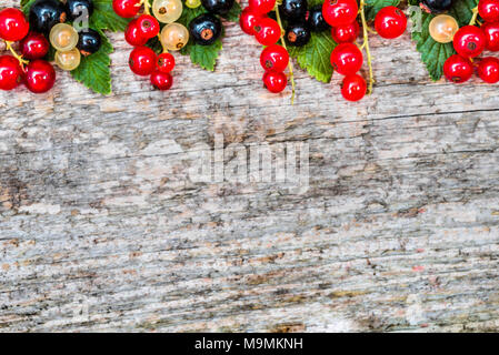 Top view of fruits, frame with berries, summer fresh currants on farm table with copy space Stock Photo