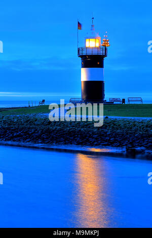 Lighthouse Kleiner Preusse with Christmas tree, Wremen, Land Wursten, Weser estuary, North Sea coast, Lower Saxony, Germany Stock Photo