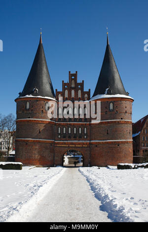 Holstentor in the winter in the snow, Lübeck, Schleswig-Holstein, Germany Stock Photo