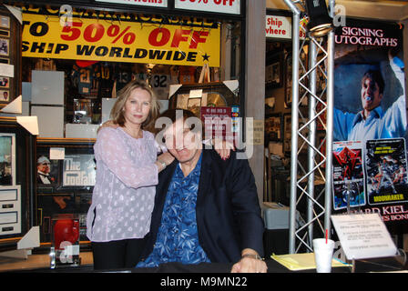 LAS VEGAS - NOVEMBER 30: Richard ' Jawz'  Kiel (The Spy Who Loved Me, Moonraker) and Maud Adams (The Man with The Golden Gun, Octopussy)  at the Gallery of Legends memorabilia store in the mall adjoining the Planet Hollywood Hotel & Casino.  on November 29, 2008 in Las Vegas, Nevada.    People:  Richard Kiel, Maud Adams Stock Photo
