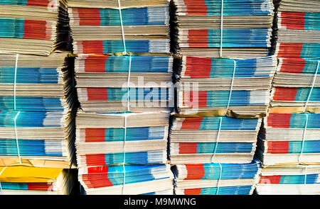 Several stacks with bundles of newspapers, London, England, Great Britain Stock Photo