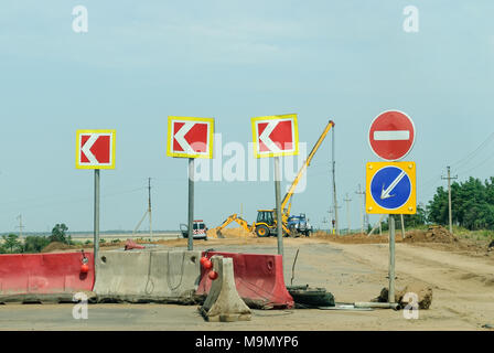 Traffic signs in a road under reconstruction. Russia Stock Photo