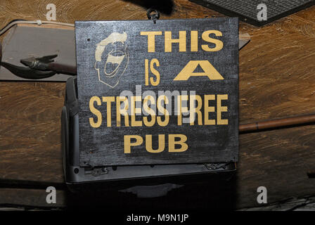 One of the many walled Irish humour signs at the famed Johnny Fox pub. It is the oldest (1798) and the highest pub in Ireland, and is situated in Glen Stock Photo