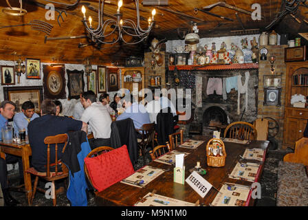 Customers at the Johnny Fox pub. It is the oldest (1798) and the highest pub in Ireland and is situated in Glencullen, a village a few miles south of Stock Photo