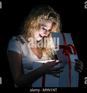 beautiful blonde woman opens the box Stock Photo