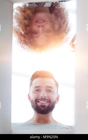 View from the bottom of the newlyweds looking inside the box. Stock Photo