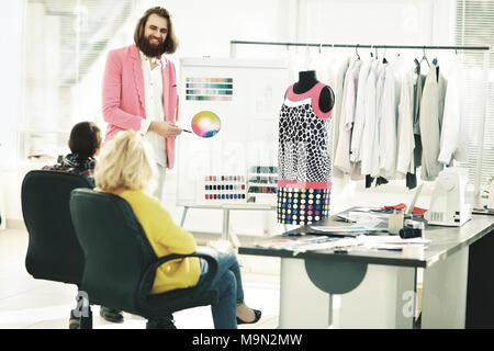 the modern designer works on new models in apparel creative Studio Stock Photo