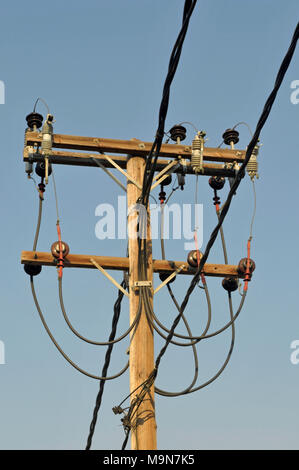 wooden pole with electric power lines Stock Photo