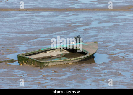 A small inshore fishing boat damaged and abandoned at Morecambe, England, UK Stock Photo