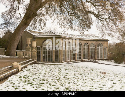 The orangery, in the grounds of the 18th Century neoclassical Blaise Castle House, north Bristol, covered in snow. It is now a museum. Stock Photo