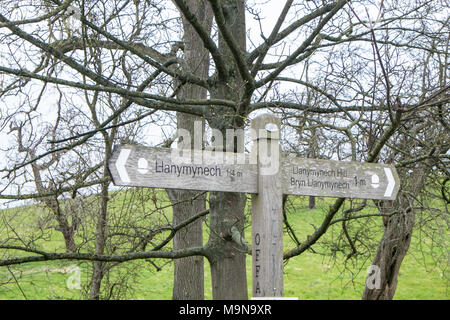 Finger,sign,signpost,on,Offas,Dike,Dyke,long,distance,National,Trail,hiking,path,along,border,of,Wales,and,England,UK.,near village,of,Llanymynech, Stock Photo