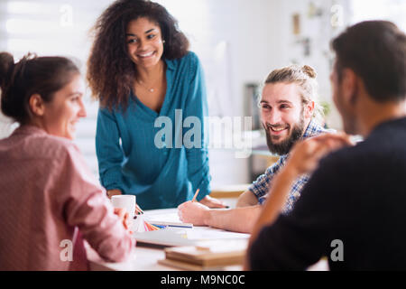 Meeting at office. a blackwoman discusses with her colleagues  Stock Photo