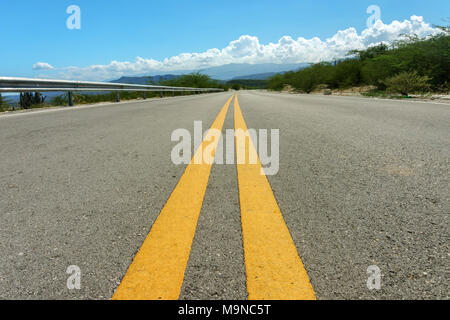 two yellow dividing strips on asphalt road. Speed highway Stock Photo
