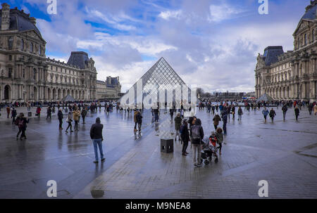 winter in paris in front of the pyramid of louvre Stock Photo