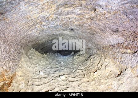 The old sandstone water tunnel, mined caves.  The cave. Sandstone tunnel moistened walls. Dry channel carved in the rocky underground Stock Photo