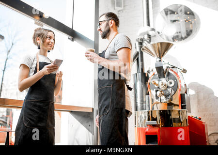 Baristas talking in the coffee shop Stock Photo