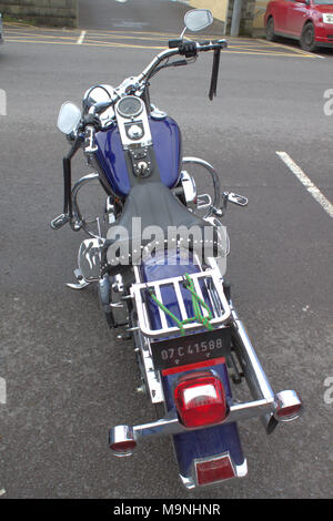 harley davidson motorcycle parked in a car park. skibbereen, ireland Stock Photo