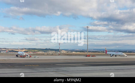 A plane prepares to take off on the runway of Terminal T4 the Adolfo Suarez Madrid Barajas Airport. Barajas is the m Stock Photo