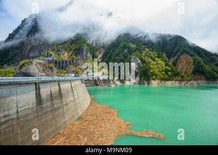 View of Kurobe Dam. The Kurobe Dam or Kuroyon Dam is a variable-radius arch dam on the Kurobe River in Toyama Prefecture, Japan. Stock Photo