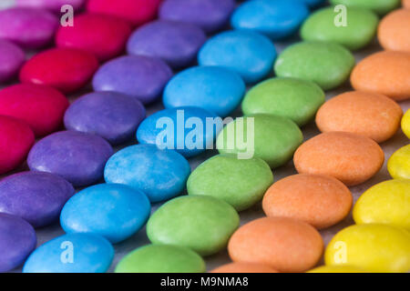 Rows of coloured sweets, smarties Stock Photo