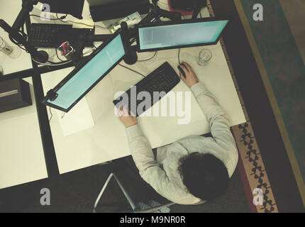 top view of software developer writing programming code on computer Stock Photo