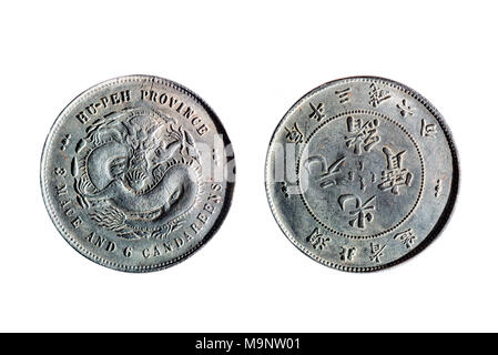 front and back of an old Chinese coin isolated on white background Stock Photo