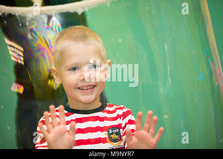 Belarus, Gomel, November 9, 2017. Gomel Children's Center. Child inside the soap bubble. Stock Photo