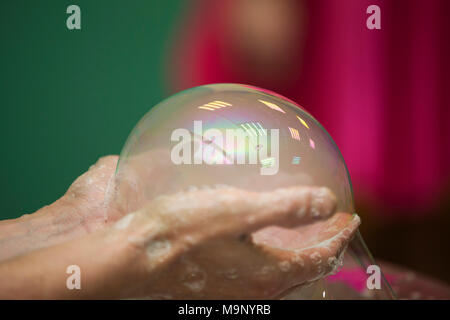 Soap bubble. Inflate the foam ball Stock Photo