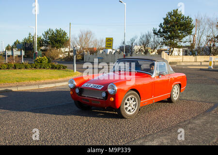 1975 70s seventies MG Midget 1500 1491cc petrol sports car; convertible, convertibles soft-top, open-topped roadster, cabriolets, drop-tops, sportscars, roadster, cabriolet motors. Stock Photo